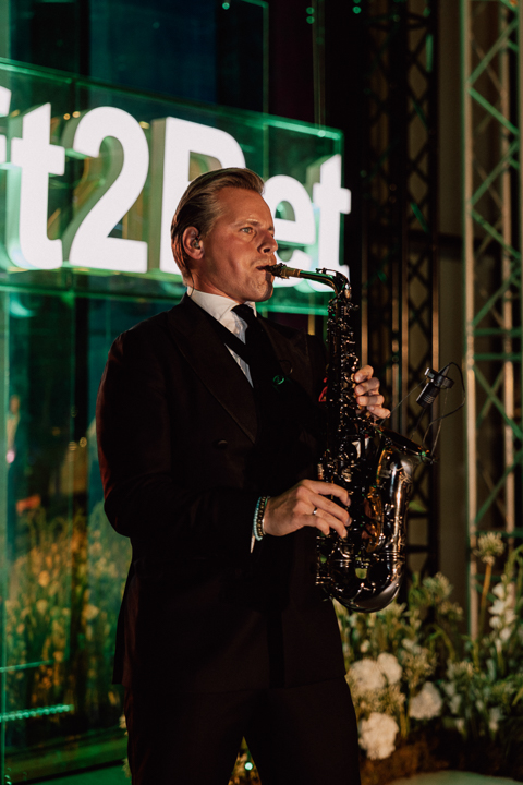 Event planning outdoor dinner setup with string lights